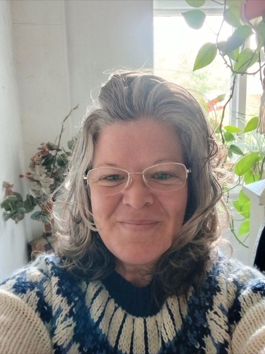 Jody Valentina at home beside her plants